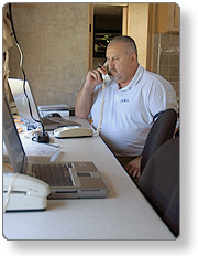 man on phone at computer