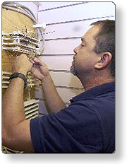Electrician wiring a control panel