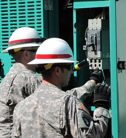 generator being installed by 2 USACE contractors