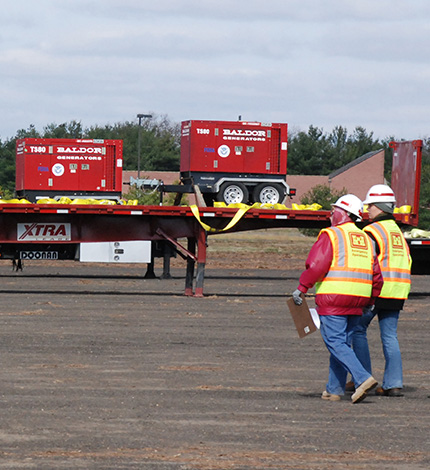 generators on a truck to haul them off of the facility premises