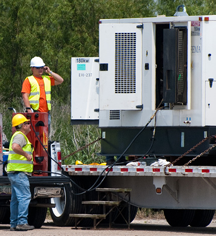 workers doing a maintenance check on generator and prepped it for reuse