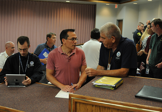 FEMA Operations Supervisor speaks with an Applicant