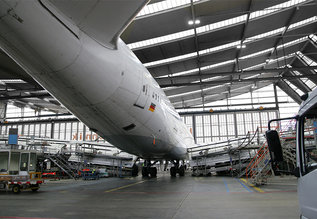 Airplane hangar with airplane inside