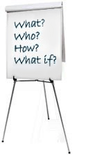 Easel chart with the words: What? Who? How? What if?