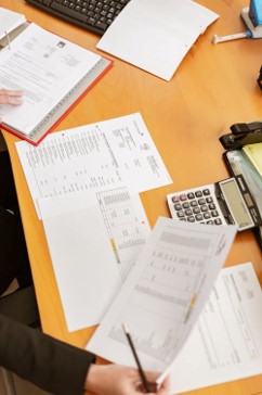 A person looking at financial documents