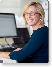 A woman working and smiling