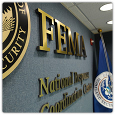 FEMA logo and DHS flag at the National Response and Coordination Center