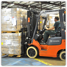 Meals Ready to Eat being moved by fork lift in a Texas warehouse