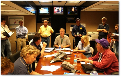 An incident command briefing at the FEMA Emergency Operations Center keeps everyone updated on progress and safety issues.