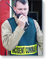 an image of an incident commander talking on a radio