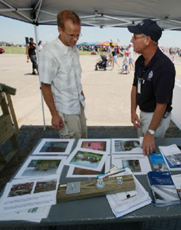 Photo of Floodplain Management staff promoting floodplain management and NFIP publications