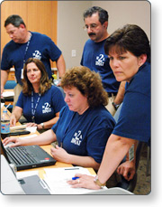 People gathered around computer