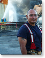 A man standing in front of a cloud of smoke