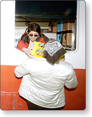 American Red Cross volunteers handing out food to survivors