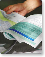 A hand flipping through a book