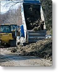 A dump truck hauling debris