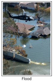 Helicopter flying over flooded community