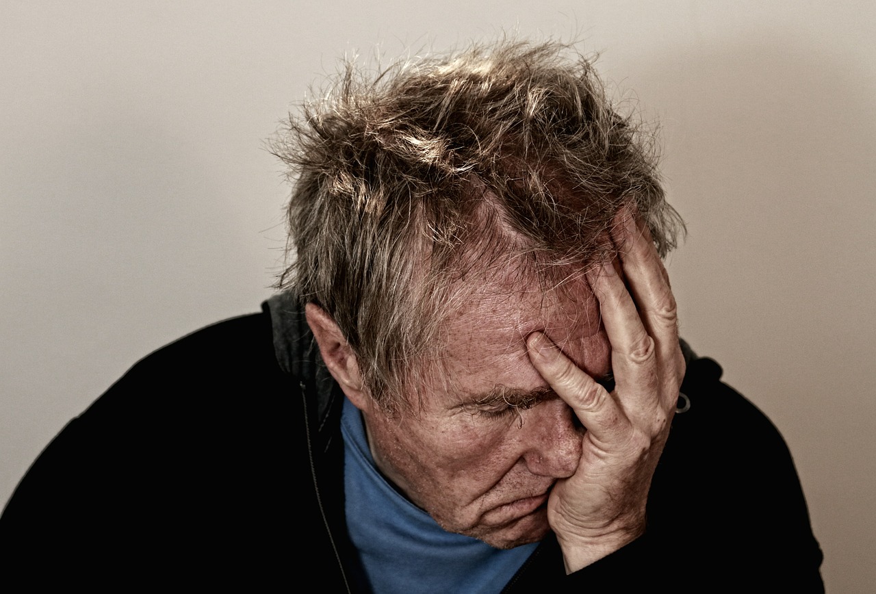 Man with head in hands