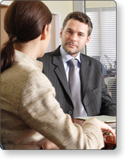 Two people having a conversation in an office