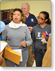 Supervisor distributing volunteer work assignments