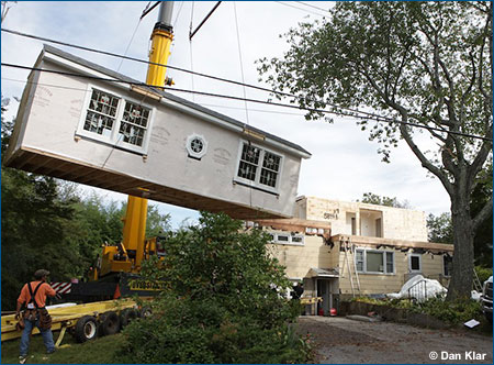 Photo of a modular home being assembled