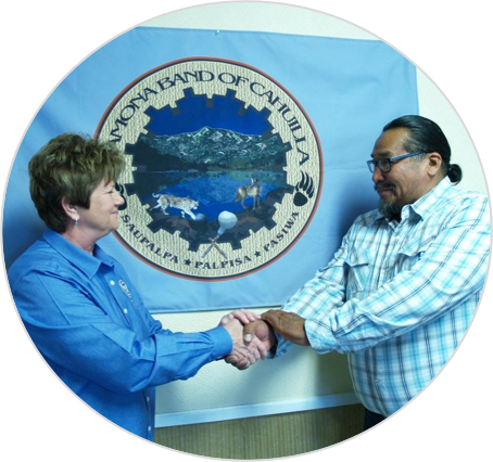 FEMA Federal Coordinating Officer Sandy Coachman (left) meets the Ramona Band of Cahuilla Tribal Chairman Joseph Domingo Hamilton for the signing of the FEMA-Tribal Agreement.