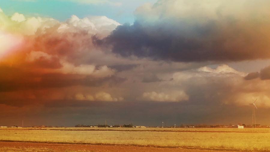 Image shows clouds and landscape