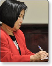 Official conducting a recovery meeting