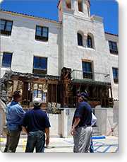 Four people looking at a building.