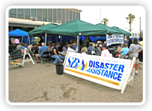 Photo of SBA employees working to help disaster survivors in a disaster stricken area