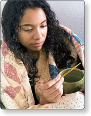 Woman checking her temperature.