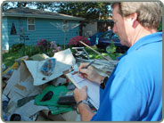 Damage Assessor taking notes of destroyed property