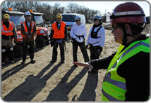 Supervisor conducting a pre-deployment briefing.