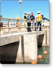 Inspecting a dam.