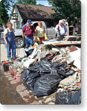 Residents add to curbside debris pile