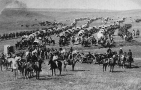 1874 photo of cavalry, artillery and wagons crossing the plains of Dakota Territory