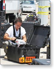 Man taking inventory of supply crate.