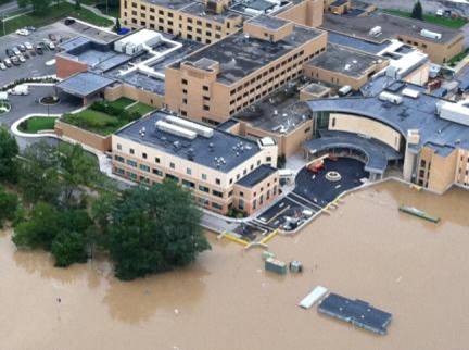 aerial photo of a hospital surrounded by flood water