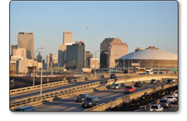 New Orleans Stadium City view depicting an interdependent infrastructure skyline including commercial skyscrapers, highways, bridges, automobiles, and electricity.