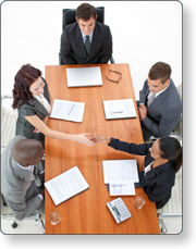 Meeting participants shake hands