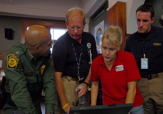 State, local, and federal partners work alongside nongovernmental volunteer organizations to assess needs and identify resources in response to Hurricane Dolly at the Cameron County Emergency Operations Center.