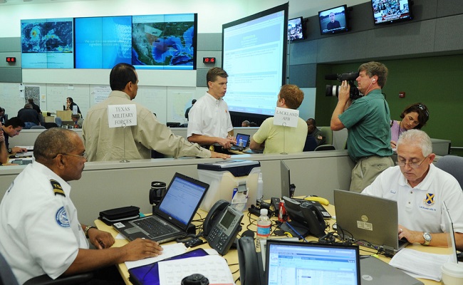 Local, state, federal and non-governmental agencies coordinating activities in their Emergency Operations Center.