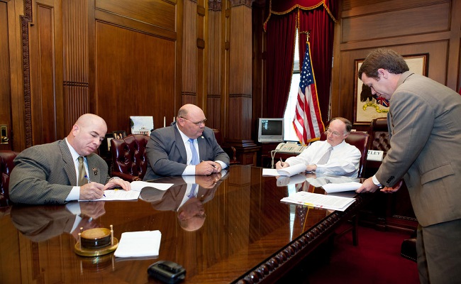 The Governor of Alabama signs the FEMA-State agreement after Hurricane Isaac.