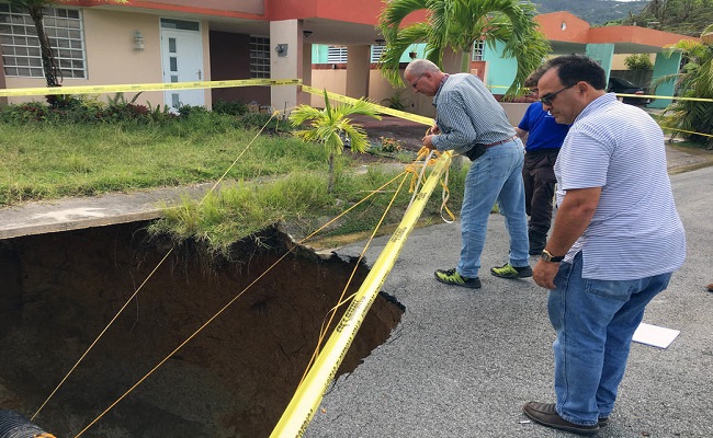 The Site Inspector and the Applicant conduct the site inspection of a washout of a road.