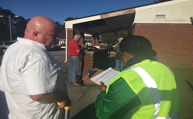 A Facilities Manager leads a FEMA Public Assistance team on a tour of county facilities to assess the damages caused from Hurricane Irma.