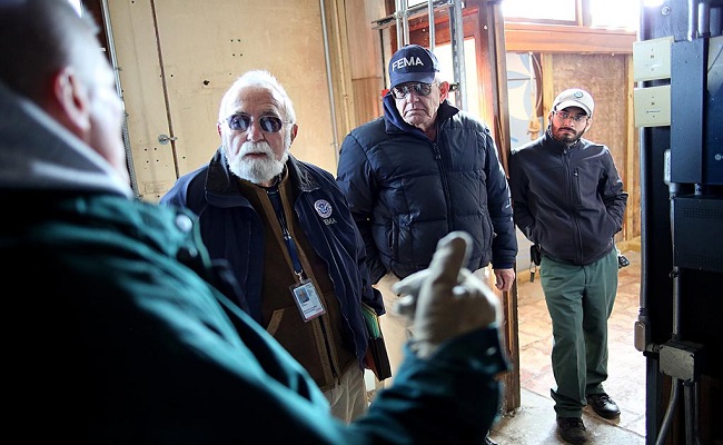 Public Assistance team meeting an Applicant during a site inspection.