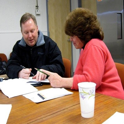 A FEMA Program Delivery Manager and Applicant discuss disaster-related damages at the Recovery Scoping Meeting.