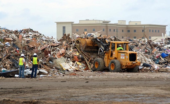 A bulldozer removing debris from Hurricane Ike