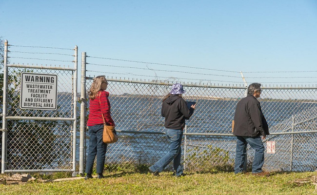 A Cape Canaveral town employee shows a FEMA Site Inspector the affected area damaged by Hurricane Irma at the waste water treatment plant.