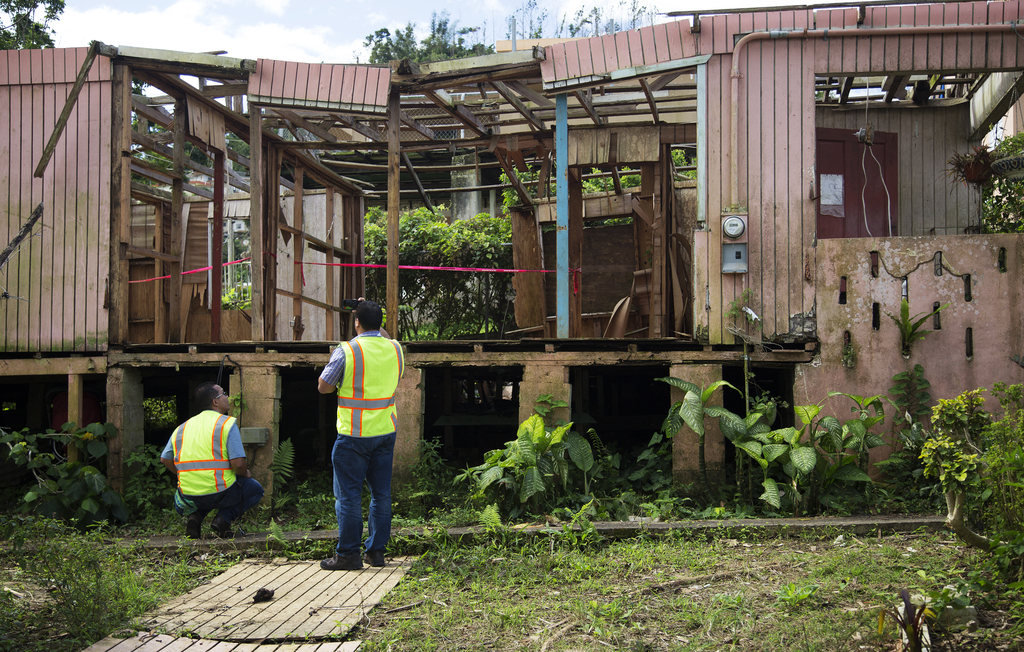 FEMA Mitigation staff survey home destroyed by Hurricane Maria.